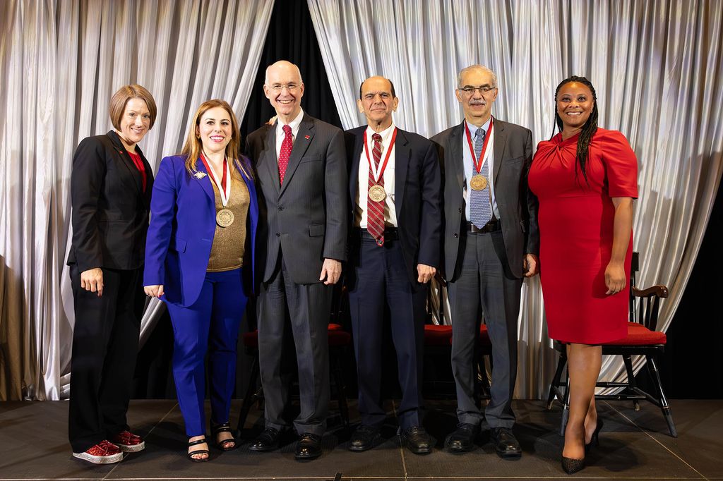 Photo: Large group photo of people posing in business casual outfits. They stand in front of a large white curtain. From left to right: Jenny Gruber (ENG’99), President, BU Alumni Association, Best of BU 2023 Alumni Award Winner, Danielle De La Fuente (CGS’04, Pardee’06), founder & CEO, Amal Alliance, Interim President of BU Kenneth Freeman, Best of BU 2023 Alumni Award Winner, Mitchell Garabedian (CGS’71, CAS’73), attorney and advocate for survivors of sexual abuse, Best of BU 2023 Alumni Award Winner, Santiago Levy (CAS’77, GRS’78,’80), economist, founder, the Progresa-Oportunidades Program and Erika N. Jordan.
