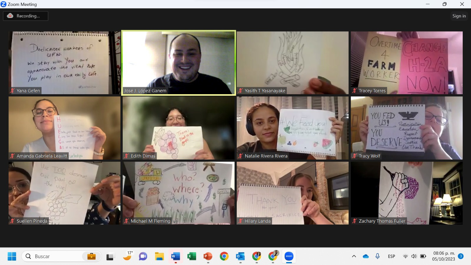 Image: Screenshot of various people on a Zoom call. The people on the call hold up small signs of protest and support inspired by Latinx and Filipino farm workers’ California Grape Strikes (1965-1970).
