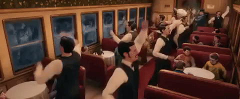 Movie gif from the film The Polar Express. This is from a scene where the characters are on the train and the waiters are doing a jig around them.