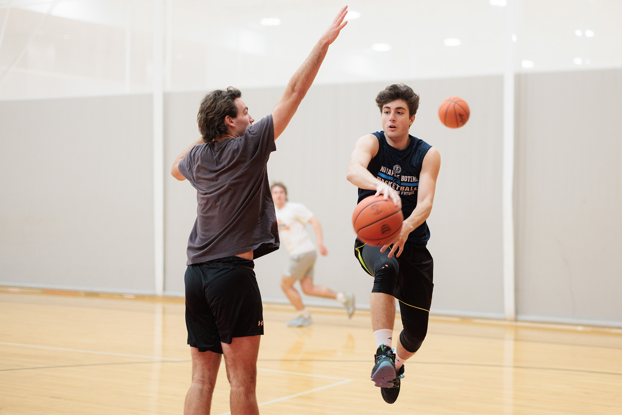 Photo: Members of the Men's club basketball team at BU practicing in gym clothes