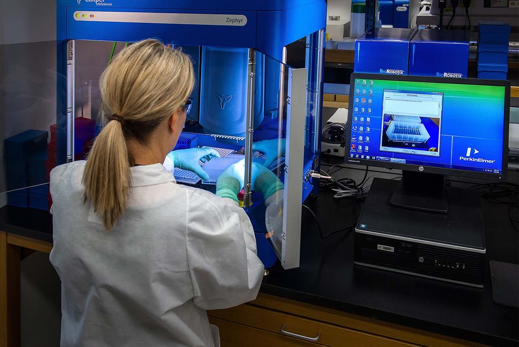 This image depicted a Centers for Disease Control and Prevention (CDC) scientist interacting with her Caliper LifeSciences’ Zephyr Molecular Biology Workstation, working with samples to be tested using a real-time PCR machine, known as a themocycler (see PHIL 22904), in order to identify the various types of poliovirus contained therein.