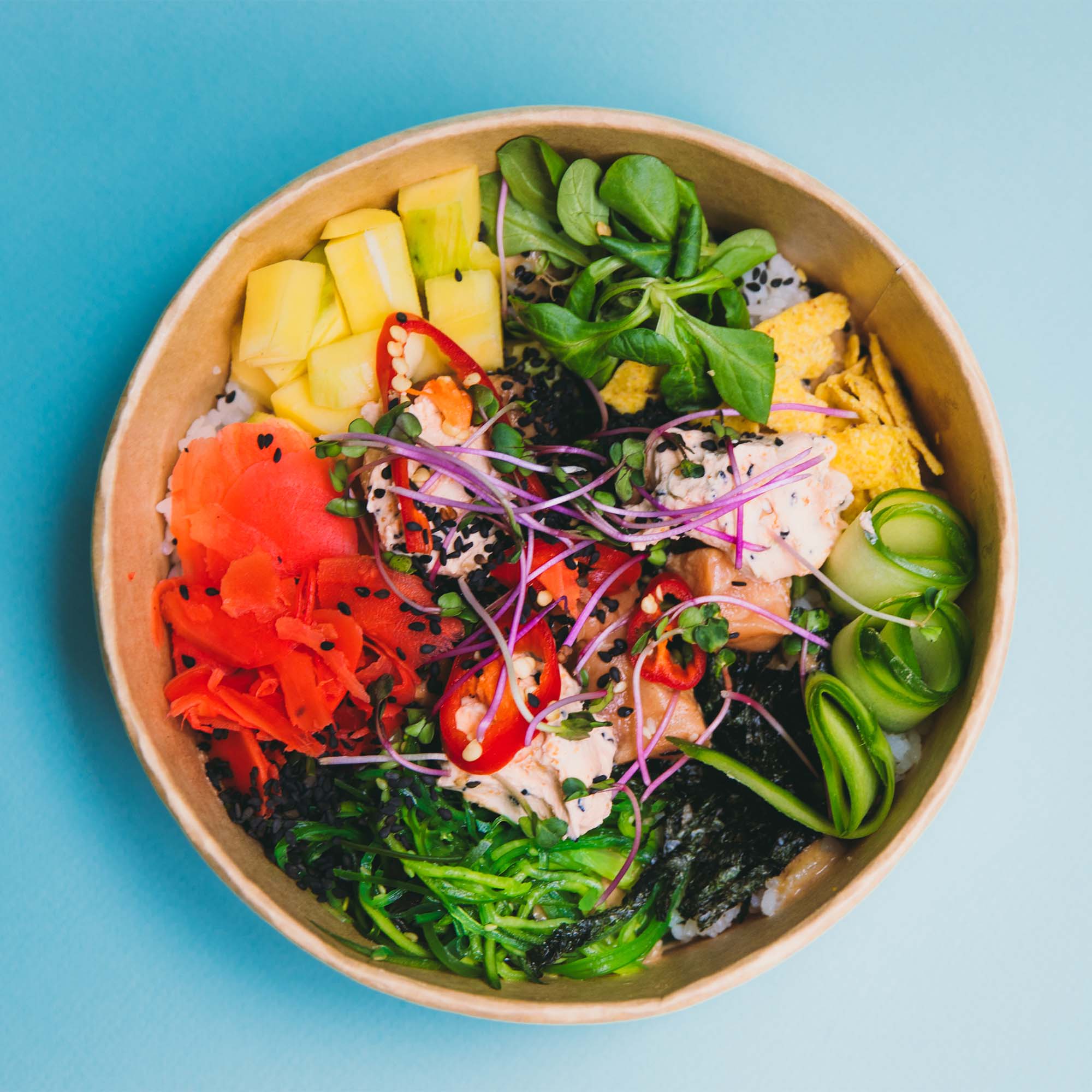 Photo: A healthy grain bowl filled with fish and many different vegetables
