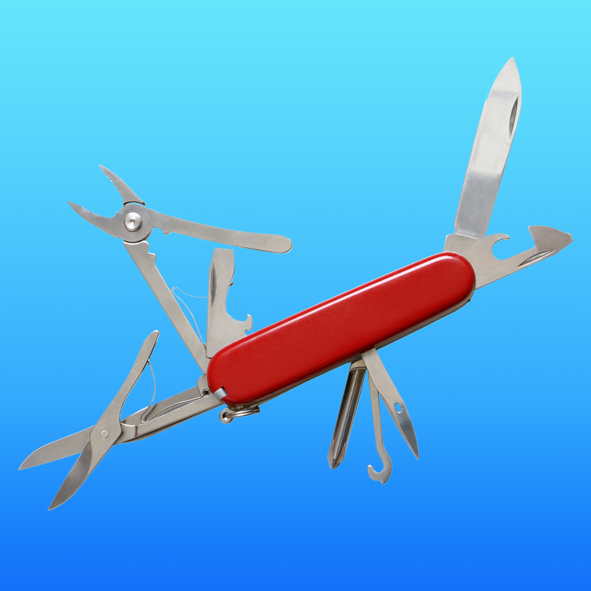 Photo: A swiss army knife with all the tools out on a blue background