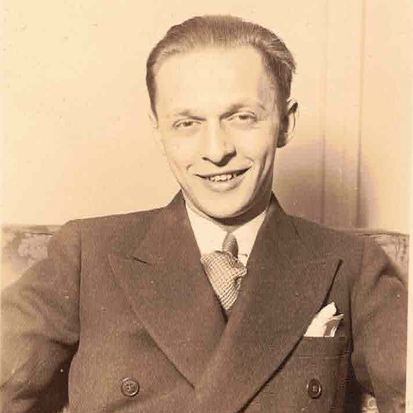 A sepia tone photo of Irwin Dribben, a man in a suit. The photo appears to be take in the 30s or 40s