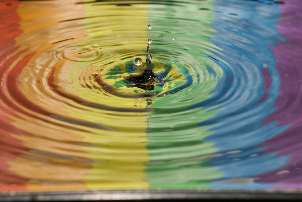 Photo: A reflective picture of a rainbow blend of paint