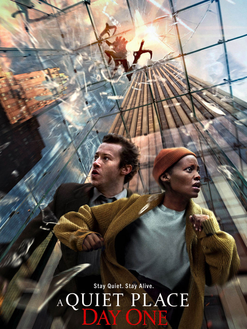 Photo: A movie poster for "A Quiet Place: Day One." It features the words "Stay Quiet. Stay Alive." over an image of an actor and actress running from alien creatures that are coming down from a shattered glass ceiling