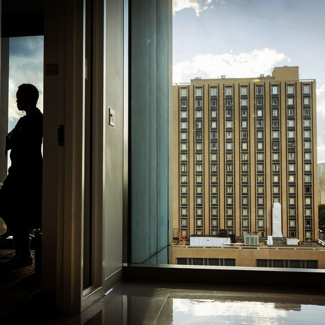 Photo: A picture of BU President Melissa Gilliam admiring the view from a campus building window