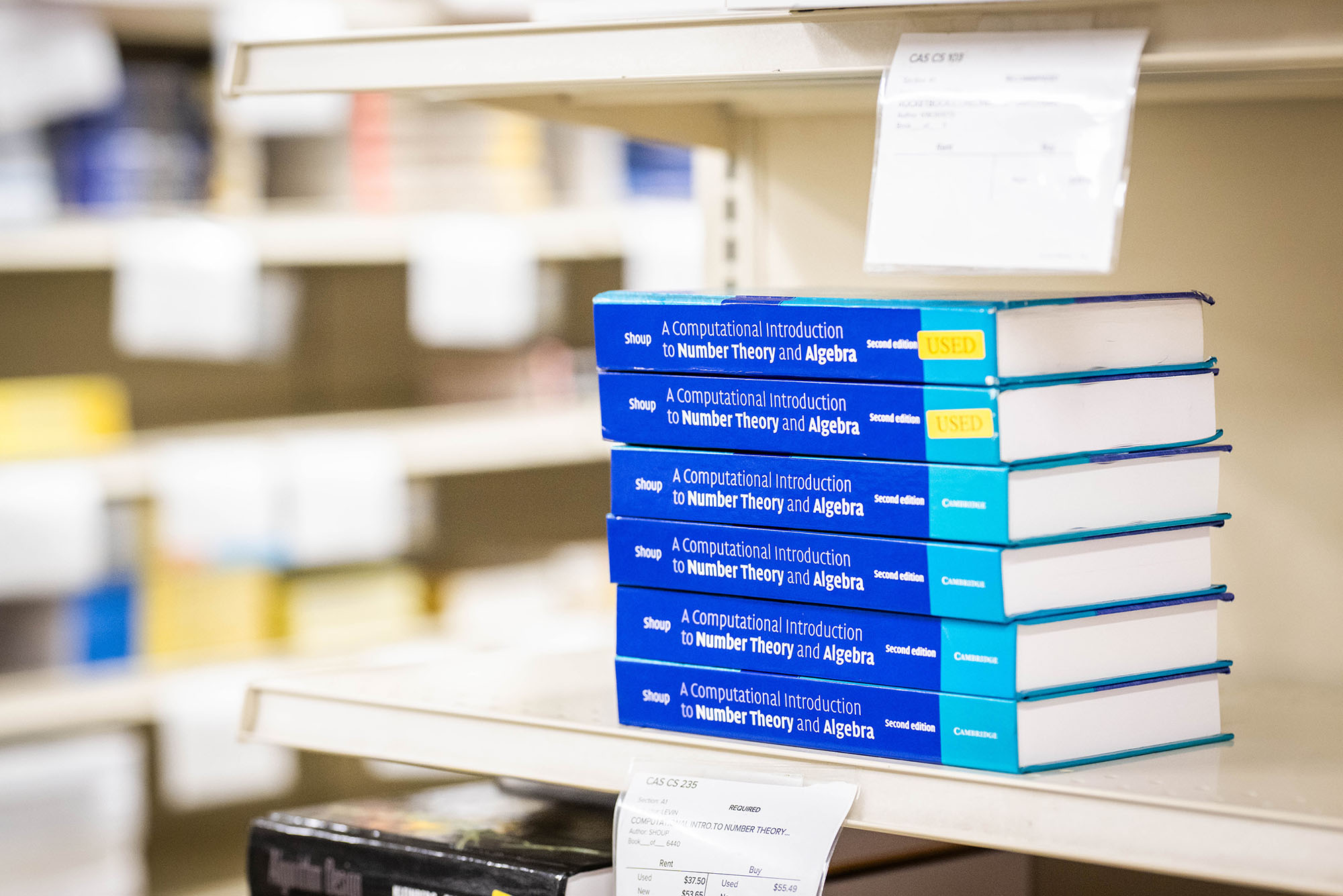 Photo: A stack of text books at the BU Campus Store.