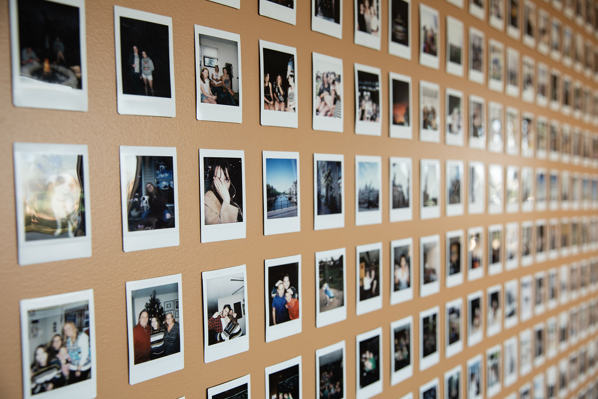 Photo: A picture of a photo wall full of polaroids