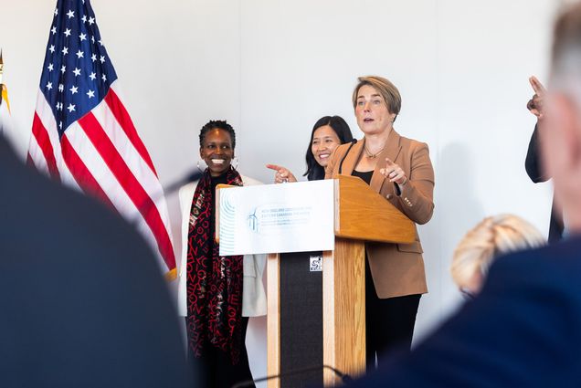 Photo: Massachusetts Governor Maura Healey (right) addresses the crowd while, Boston University President, Melissa L. Gilliam (left) looks on with Boston Mayor Michelle Wu on during the 2024 Conference of New England Governors and Eastern Canadian Premiers at the Center for Computing and Data Sciences