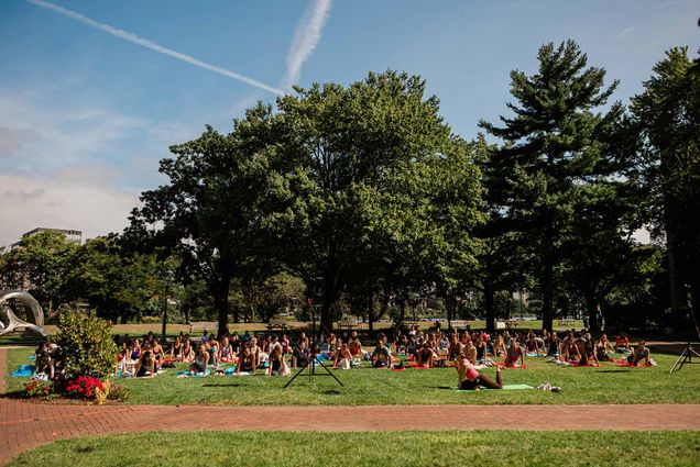 Photo: Boston University’s Fitness & Recreation Center leads yoga on the BU Beach as part of Weeks of Welcome.
