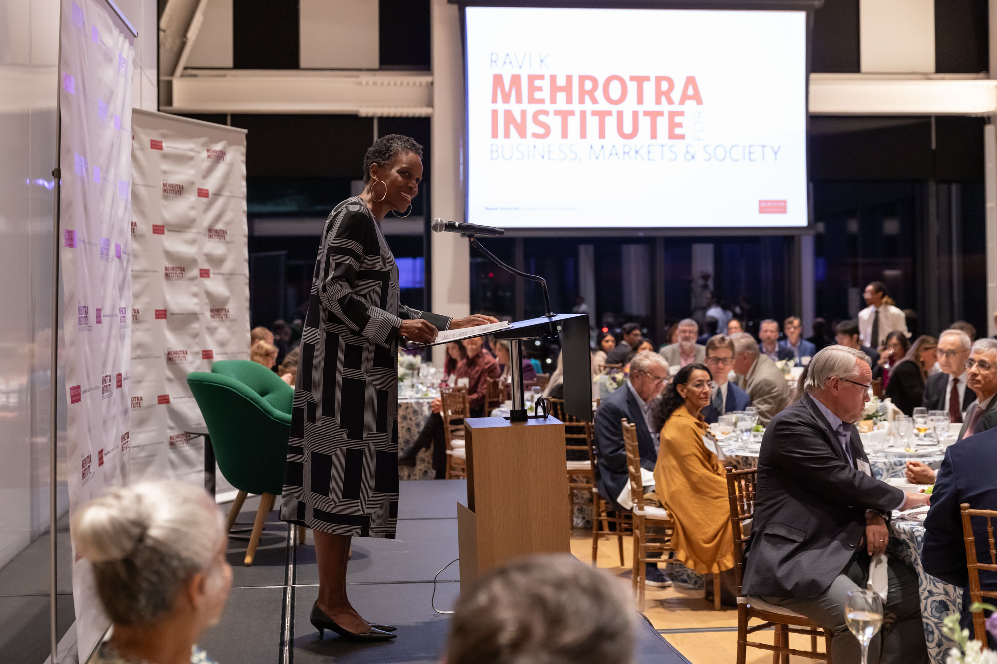 Photo: BU President Dr. Melissa Gilliam giving a speech behind a podium in front of an audience