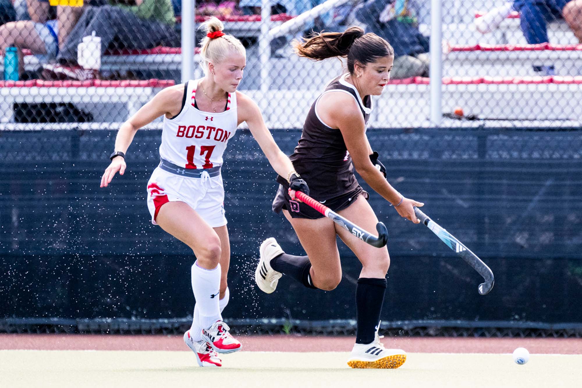 The field hockey team celebrates a shoot-out victory over Brown University September 8. Katie Devine (CAS’25) scored two goals and converted in the shootout to help the Terriers break a two-game losing streak. Photo by Jon Ratner