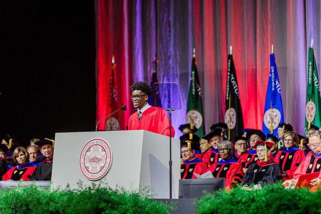 Photo: Akwasi Antwi (CAS’25), president of BU Student Government, stands at a podium to give a speech.