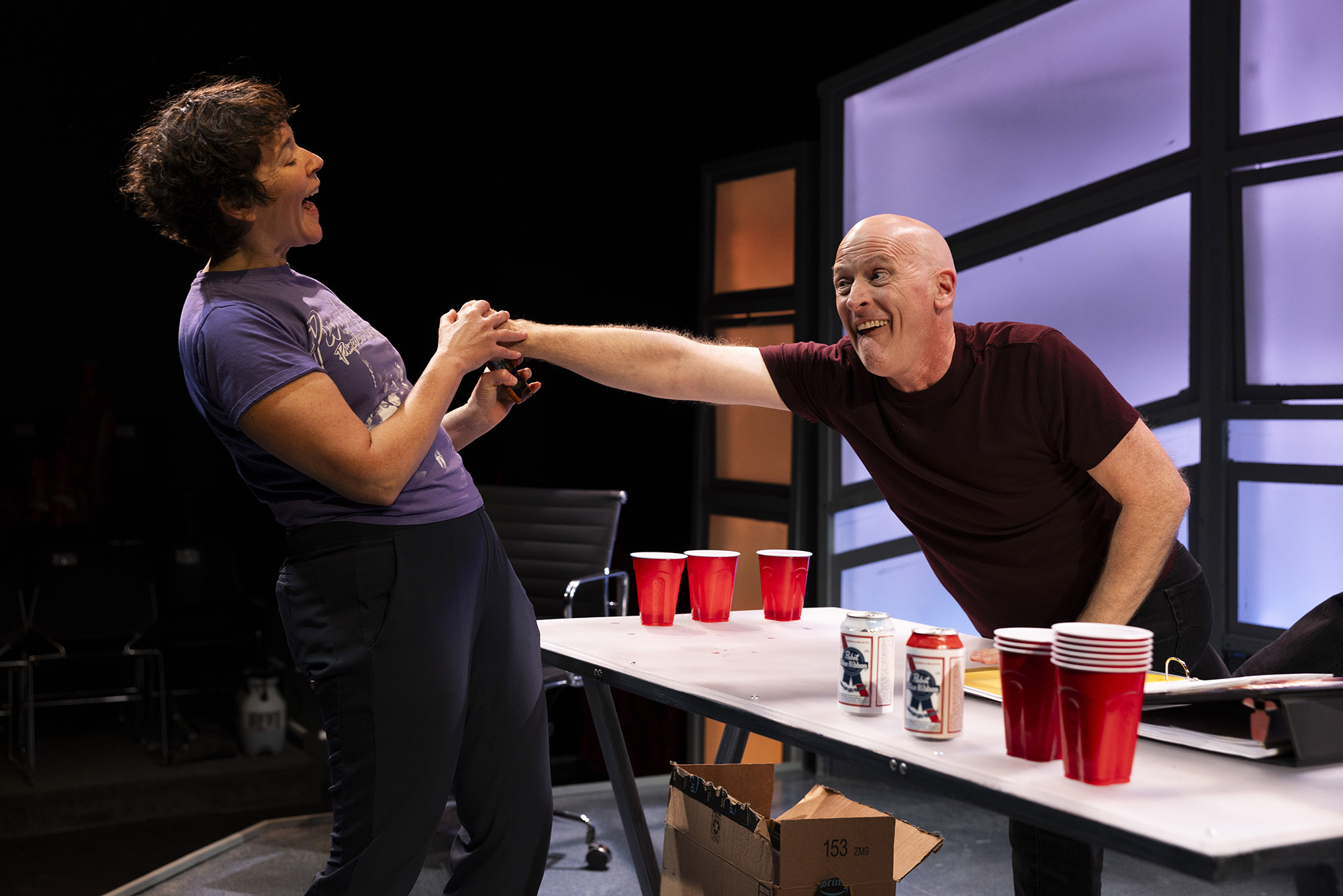 Photo: Becca A. Lewis (left) and Mark W. Soucy rehearsing for How to Not Save the World with Mr. Bezos by Maggie Kearnan at Boston Playwrights Theatre earlier this week.