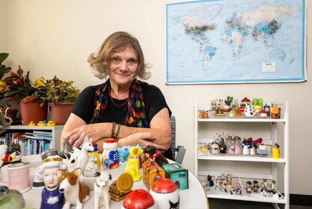 Photo: Deb Jancourtz, assistant director of career education at the CCD, for Office Artifacts, poses in her office with her various ceramic shakers.