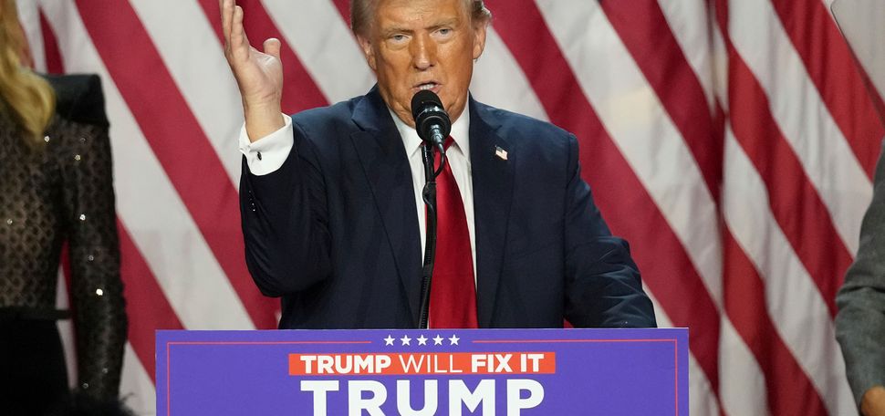 Photo: Donald Trump standing behind a podium at a recent rally