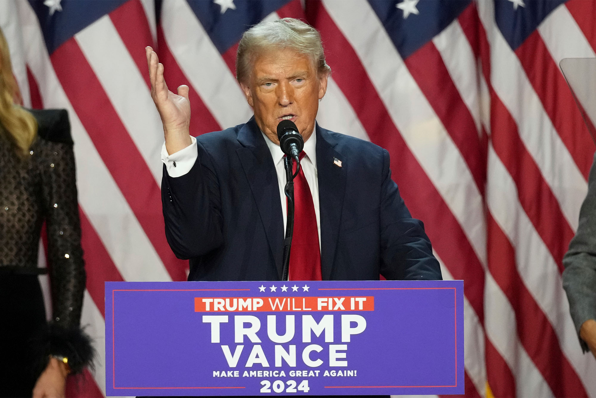 Photo: Donald Trump standing behind a podium at a recent rally