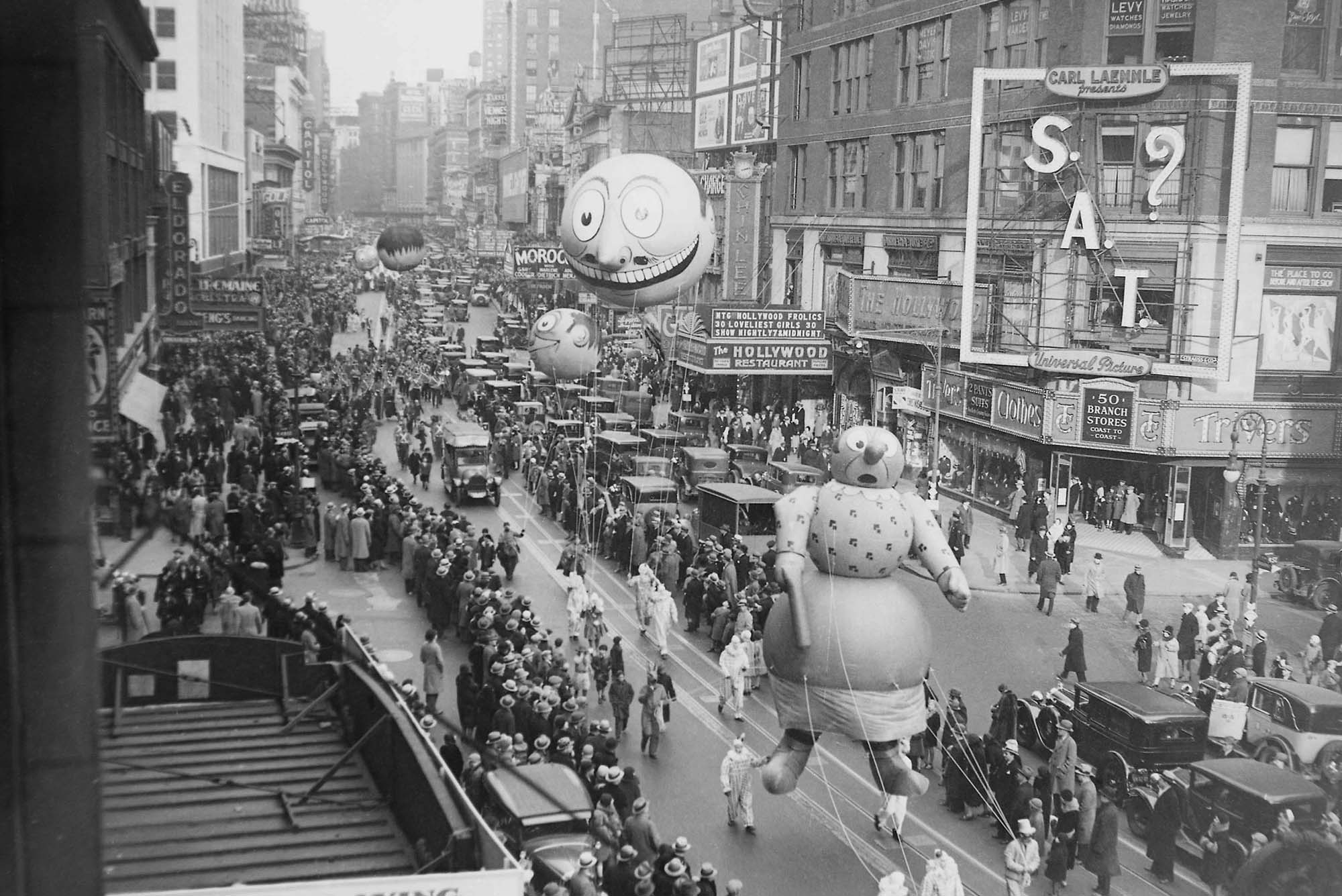 Photo: A black and white archive picture from the 1930 Macy's Thanksgiving Parade featuring large parade floats