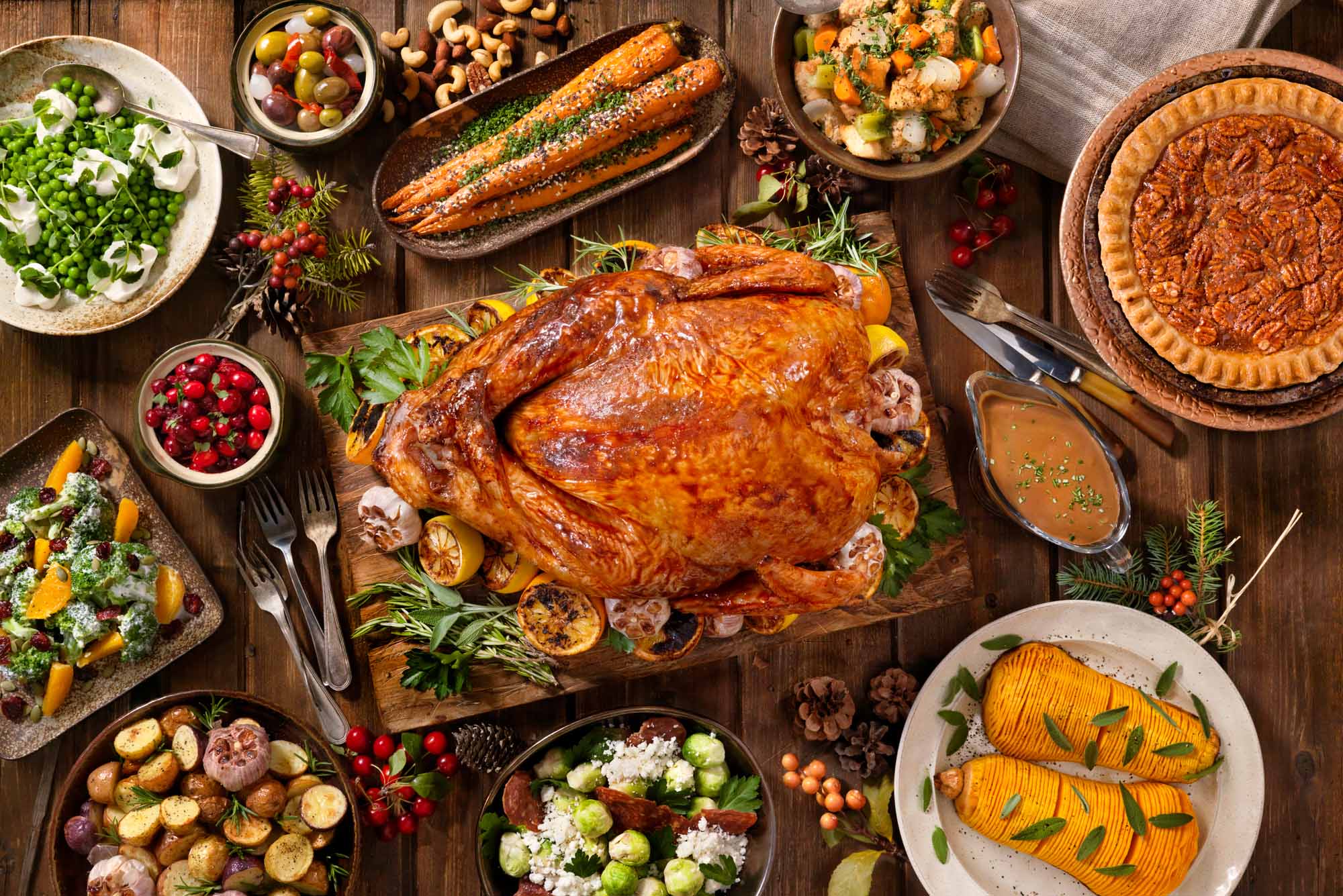 Photo: A Thanksgiving dinner table set with a turkey and various side dishes