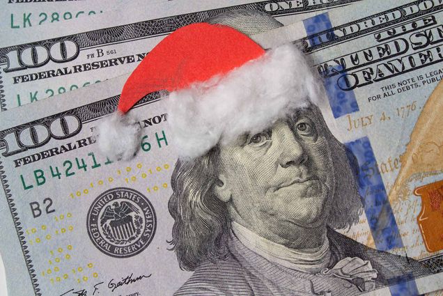 Photo: $100 bill with Ben Franklin on the front wearing a santa hat