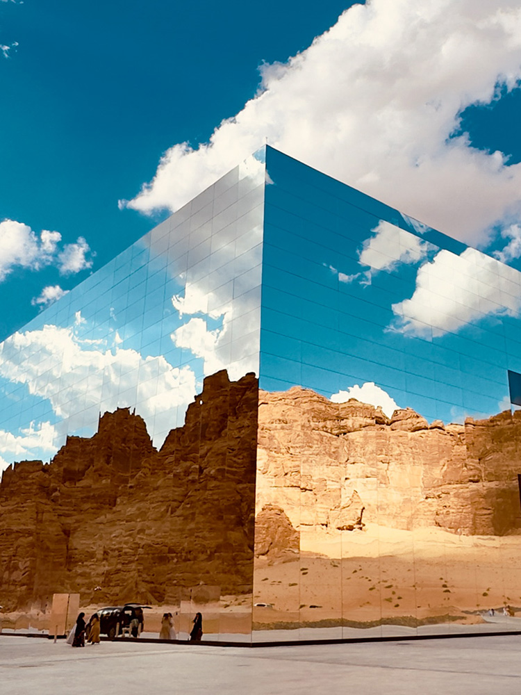 Photo: A mirror-like building in a desert landscape