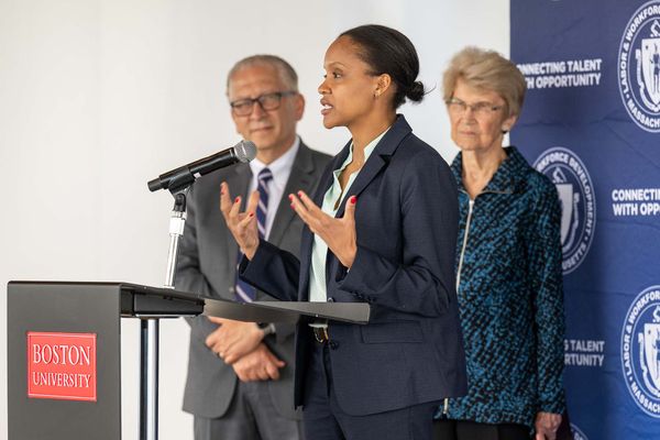 5/30/25 -- Boston, MassachusettsCDS associate provost Azer Bestavros, left, and former Lieutenant Governor of MA, and president of The WAGE Project, Inc. Evelyn Murphy, listen as Secretary of Labor and Workforce Development Lauren Jones takes the podium at a meeting to share about BU's contribution to Massachusetts' new wage-equity legislation called Pay Equity Law May 30 at CDS.Photo by Cydney Scott for 波士顿大学 Photography