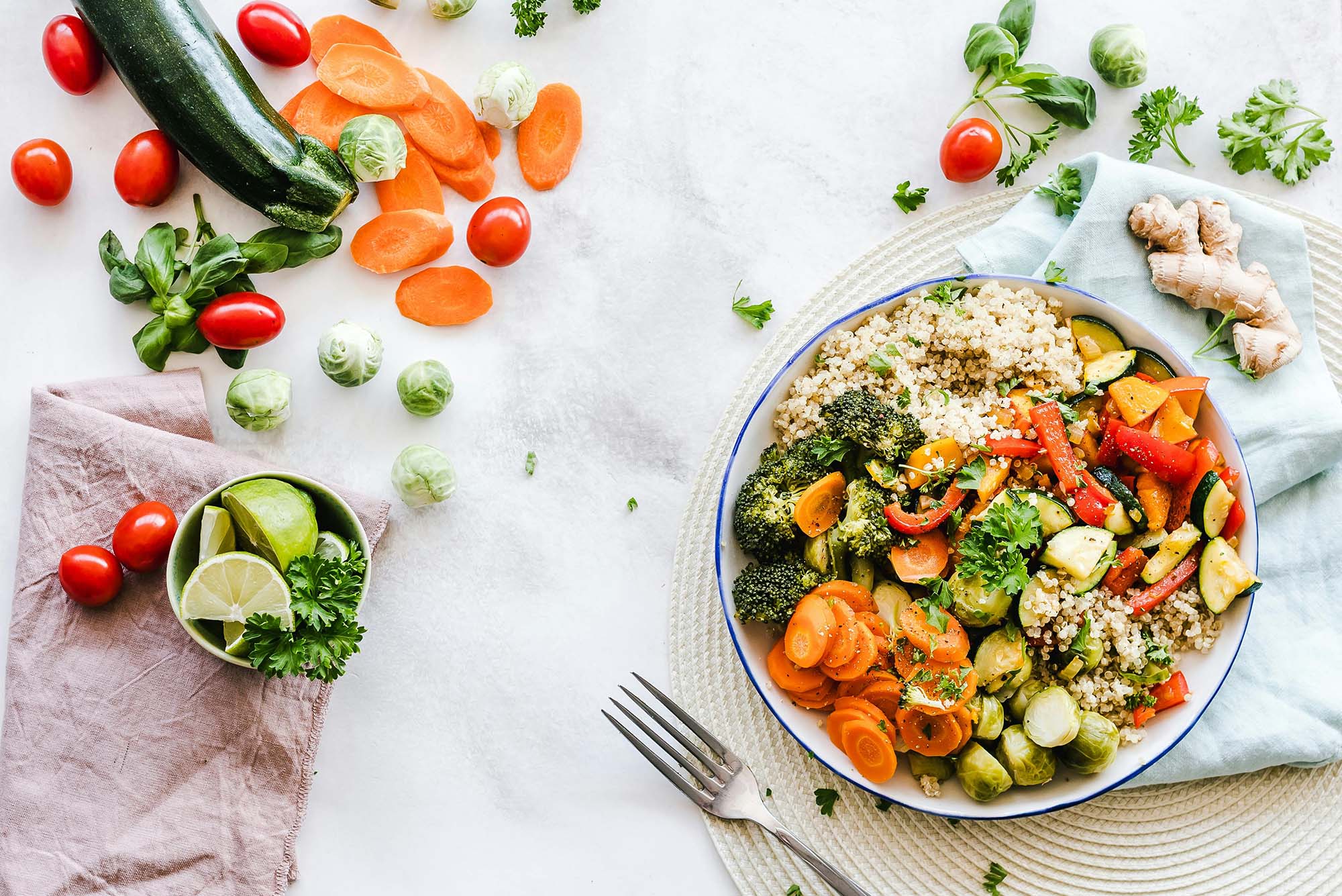 Photo: A bowl of many vegetables next to a table full of more greens