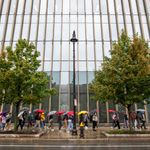 Umbrellas add a touch of color to a dreary Thursday, as Terriers wend their way past the Kilachand Center for 生命科学 & Engineering. Rain dumped nearly an inch on Boston, and Friday is expected to be much cooler, with a high of only 60. Could be fall has arrived. September 22 photo by Cydney Scott. Students walk in front of a large modern building with umbrellas in rainy weather