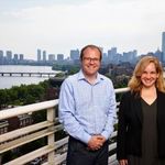 Benjamin Sovacool and Rebecca Pearl-Martinez with Boston cityscape in background