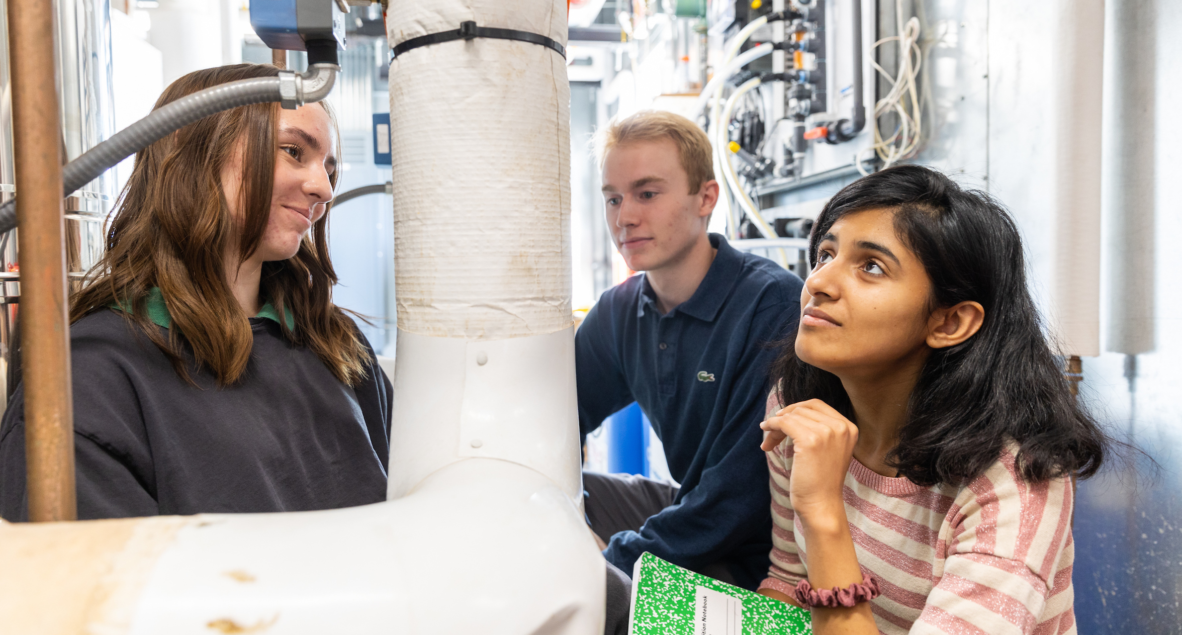 Students examining HVAC