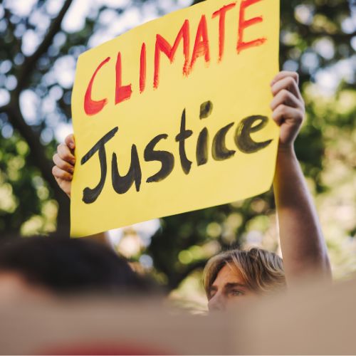 Person holding a climate justice sign