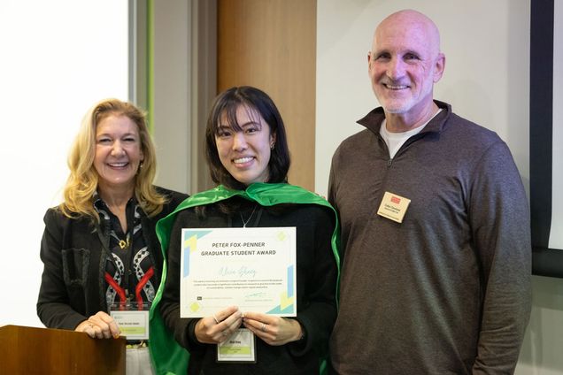 (Pictured left to right): IGS advisory board co-chair Penni McLean-Conner presents the 2024 IGS Peter Fox-Penner Graduate Student Award to Alicia Zhang (Earth & Environment) with advisor Professor Cutler Cleveland, an IGS associate director.
