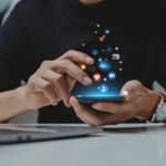 Person scrolling social media on phone.