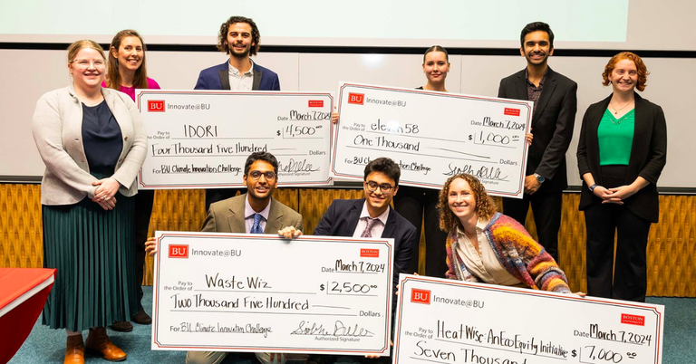 A group of student founders poses with their prize money checks