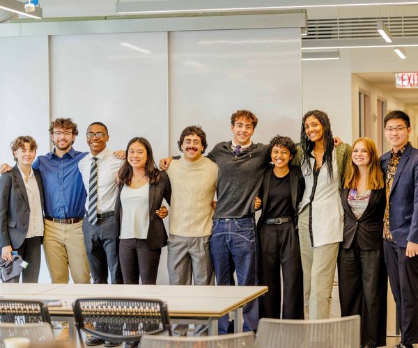 The Enlight Social Impact Incubator cohort smiling arm in arm