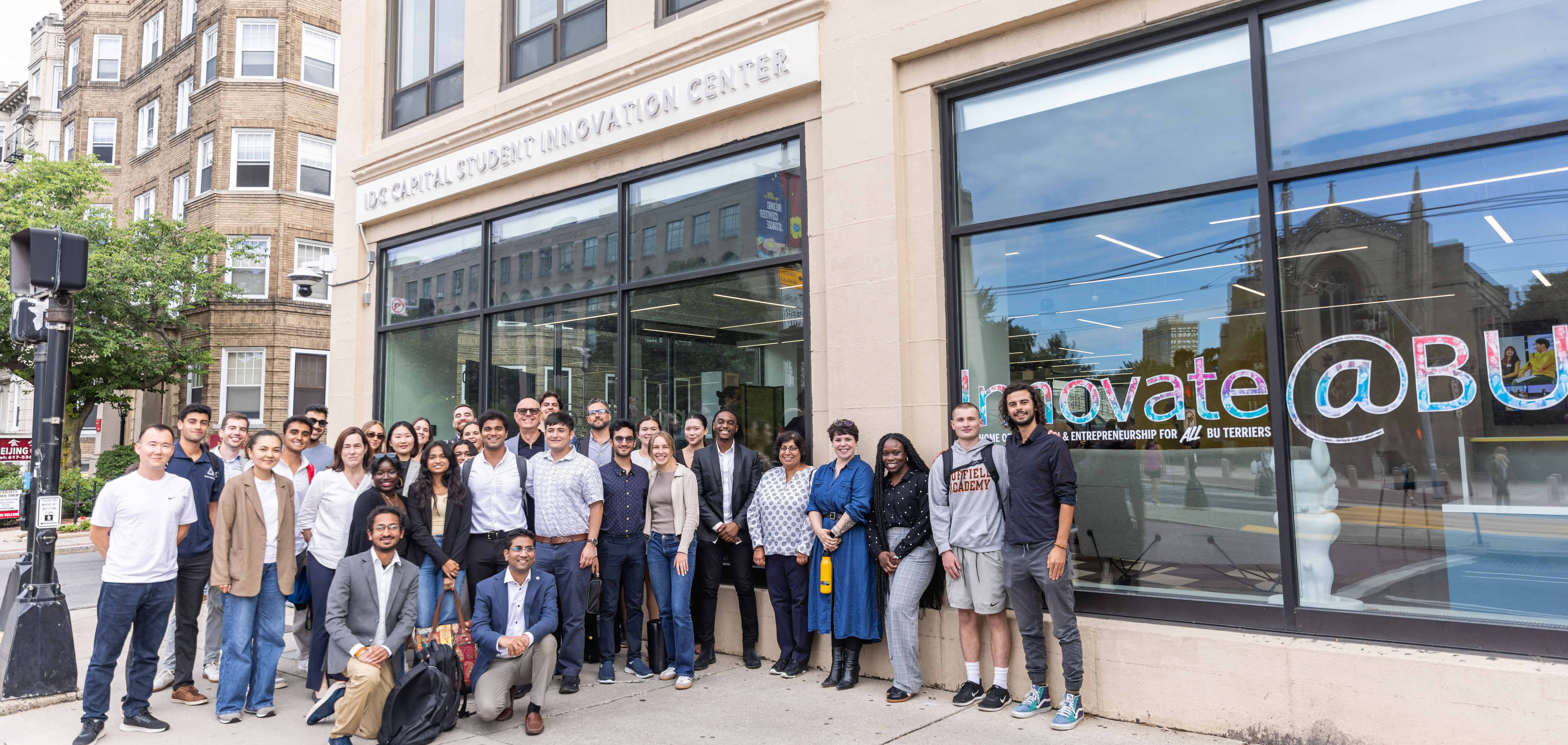 Group photo of students and employees standing outside IDG Capital Innovation Center