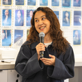Smiling while talking into microphone