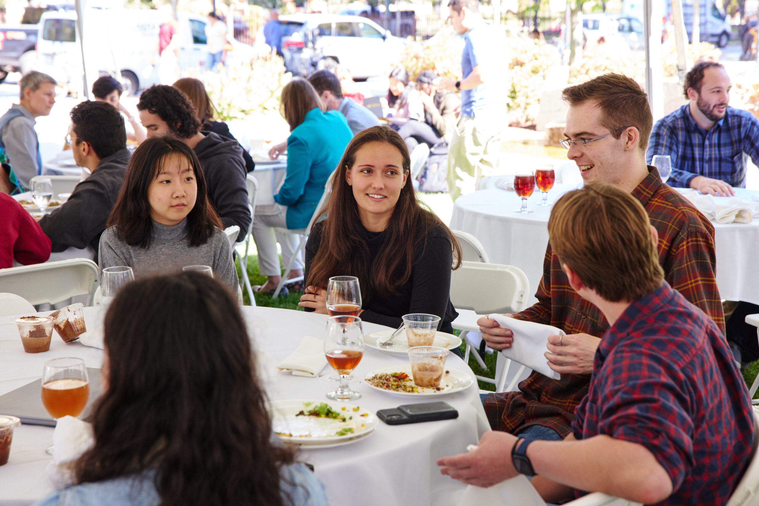 People at outdoor lunch reception during Kilachand Day event