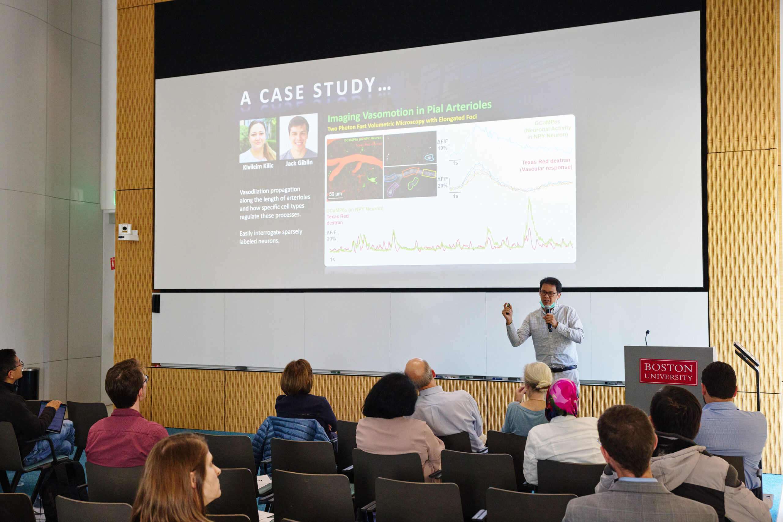 Man presents in colloquium room