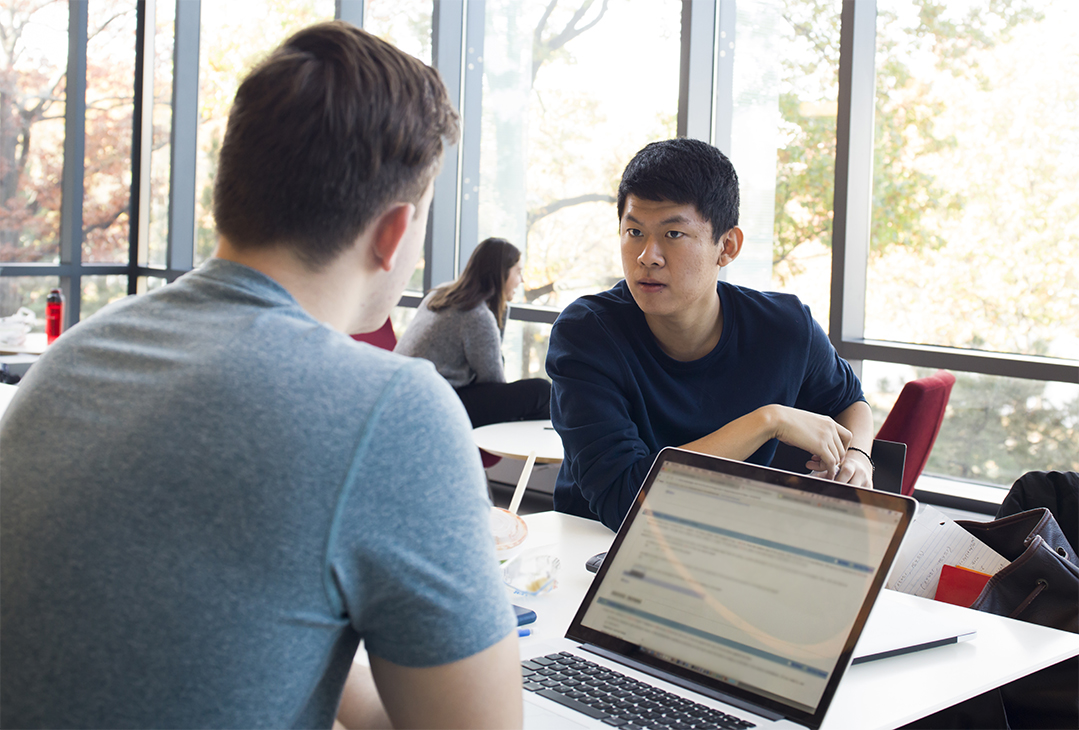 BU Law students working in McCausland Commons. Photo by Tim Llewellyn for Boston University Photography.
