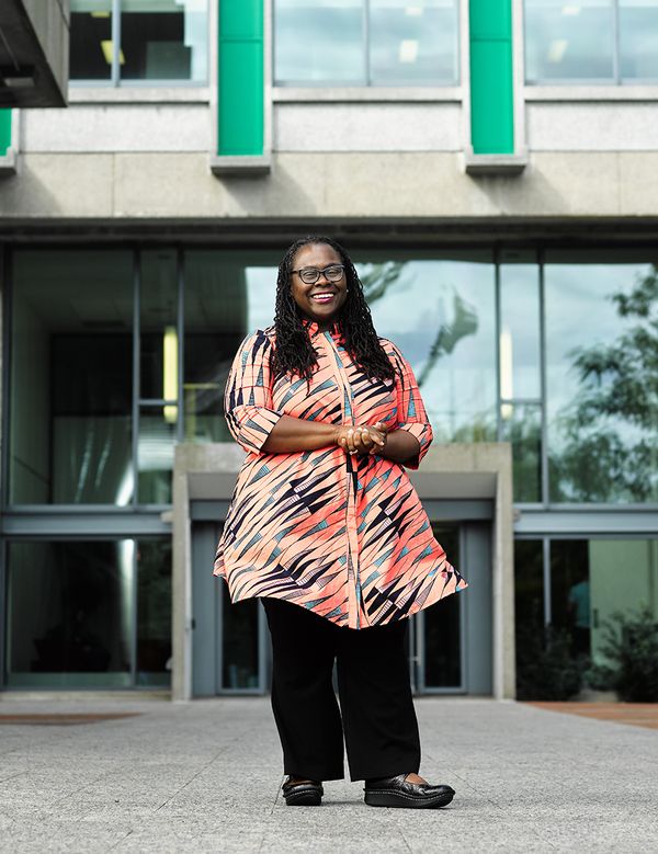 Dean Angela Onwuachi-Willig in front of the BU Law tower
