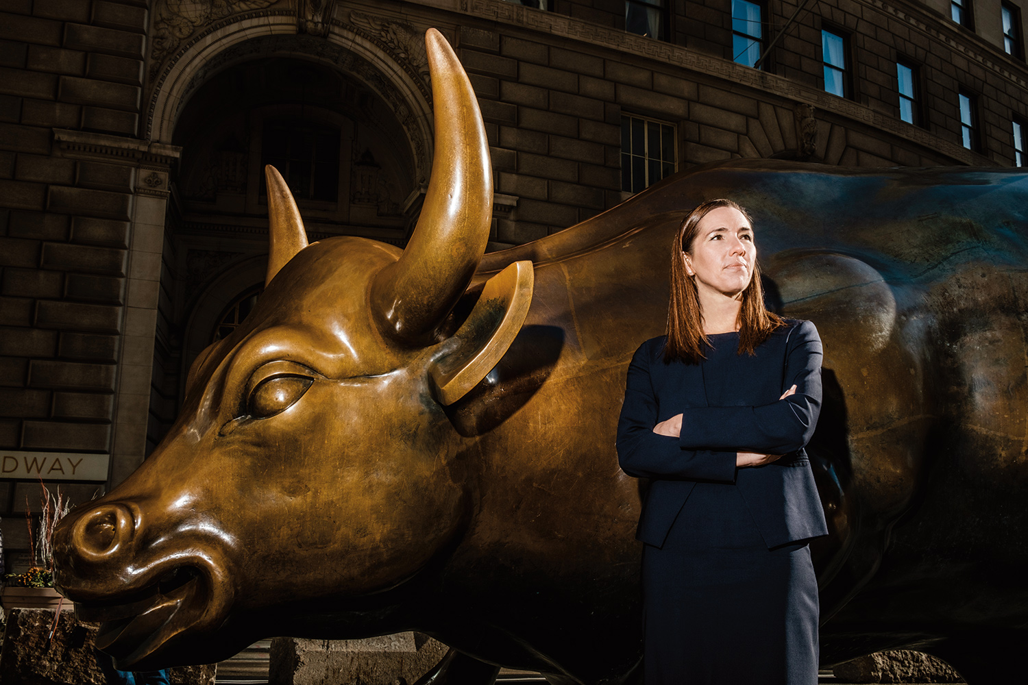 Jennifer O'Neil ('07) stands before the Charging Bull statue on Wall Street in New York City