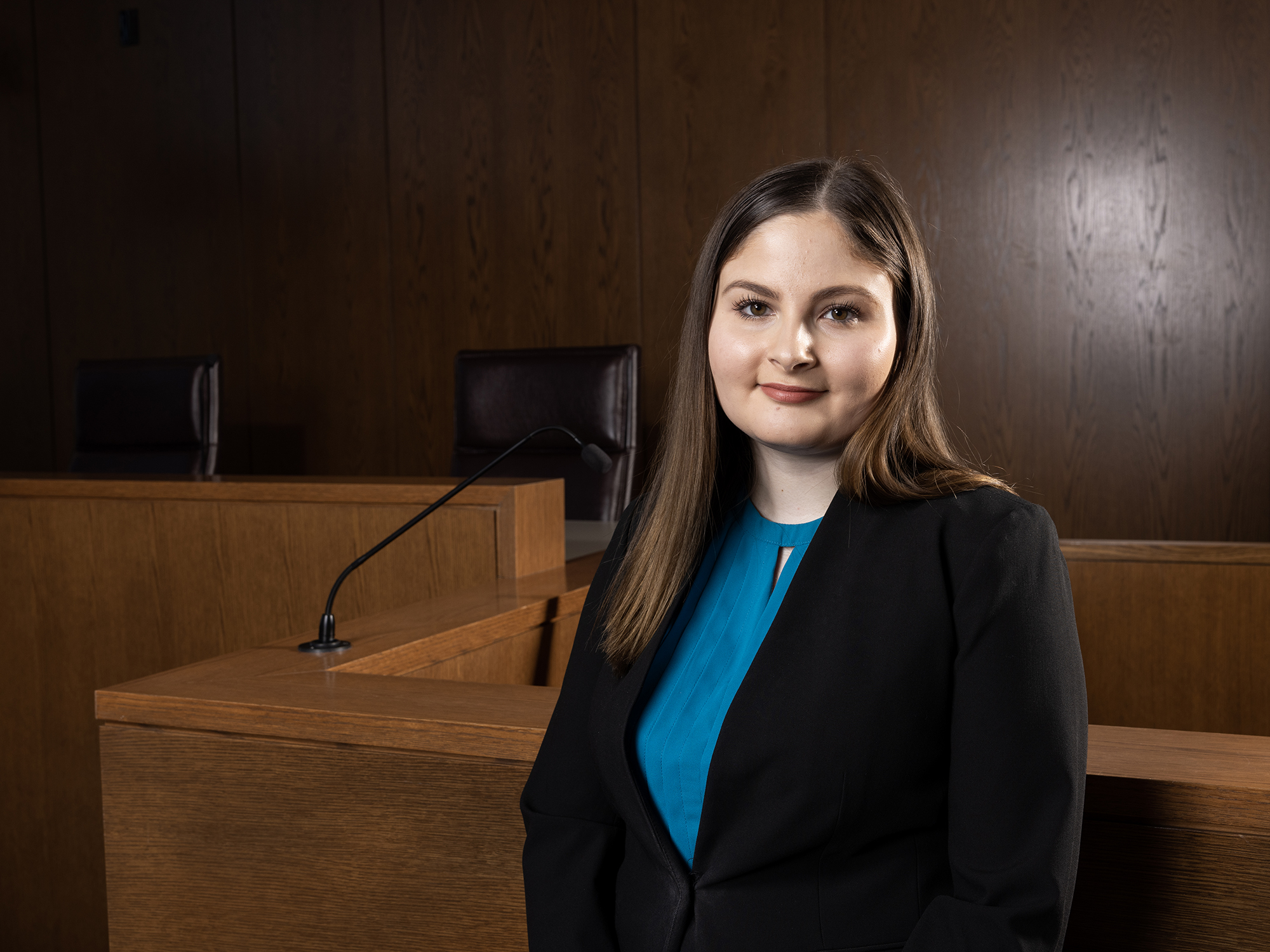 Julie Antonellis, Class of 2023, stands in a moot courtoom