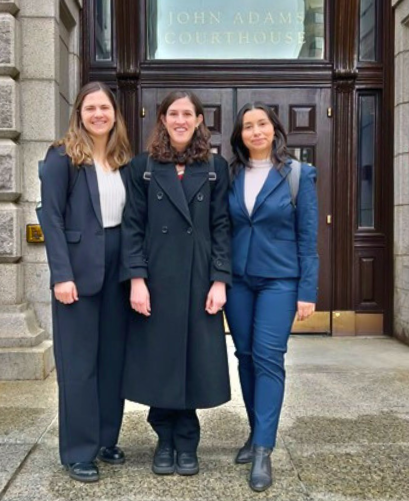 Sadie Keller ('25), Professor Caitlin Glass, and Gissela Moya ('25) stand in front of the John Adams Courthouse.
