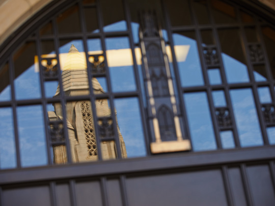 Stay in touch - image shows a reflection of the city in a building window.