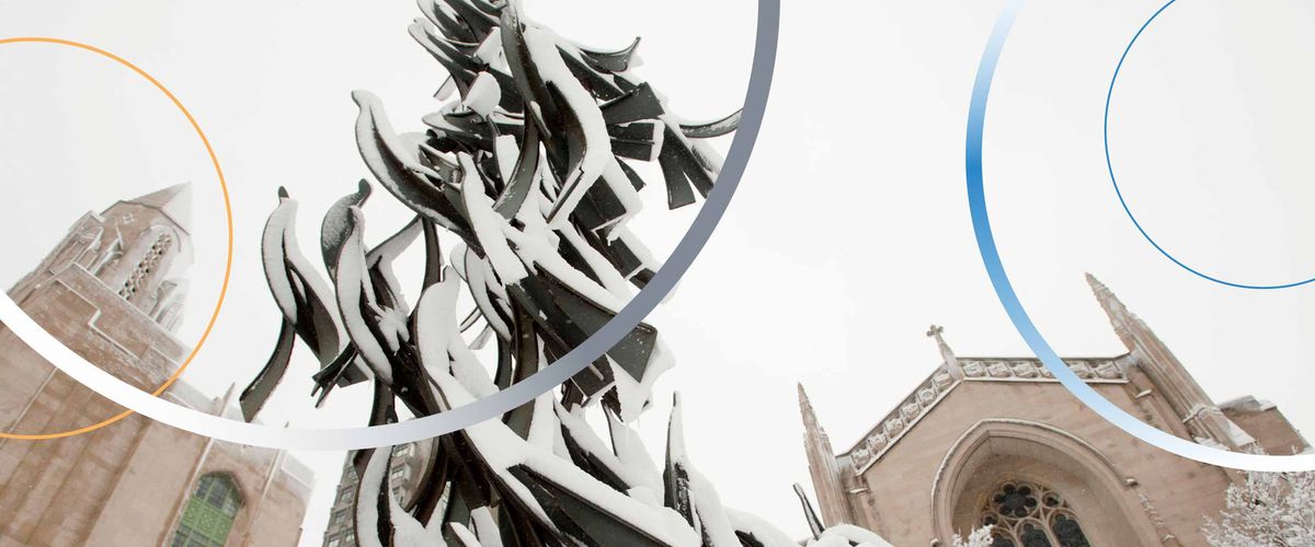 The sculpture “Free at Last” by Sergio Castillo in Marsh Plaza, covered in snow