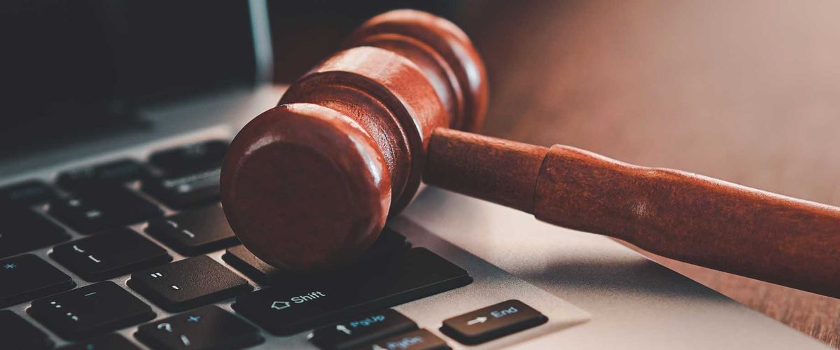 A gavel set on top of a laptop keyboard