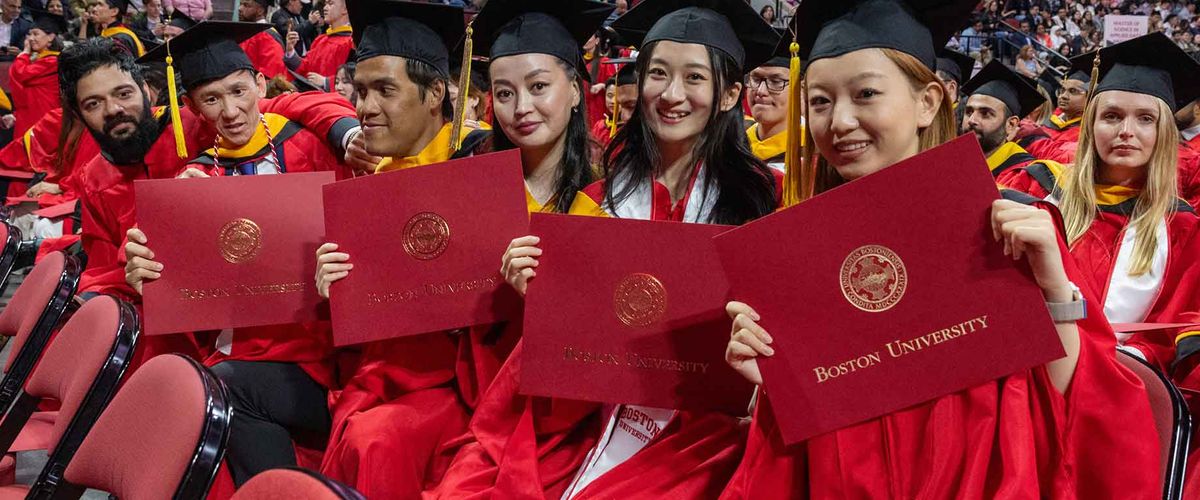 Graduates posing with their diplomas at the 2024 MET convocation ceremony