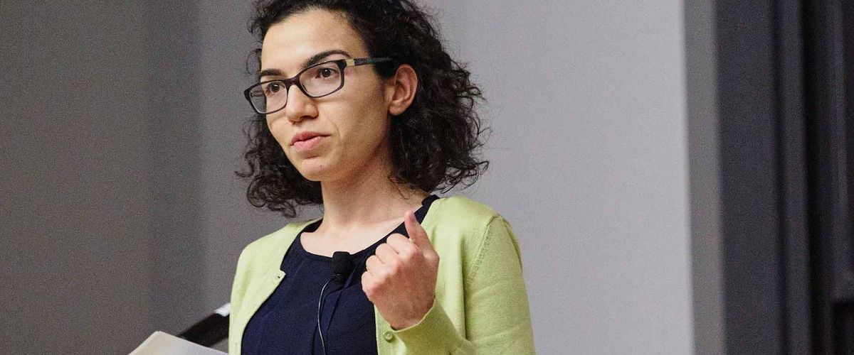 Associate Professor Canan Gunes Corlu speak在g at a panel discussion